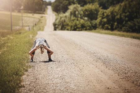 The best kind of change comes from a challenge. a young woman taking a break while out for a run.の写真素材