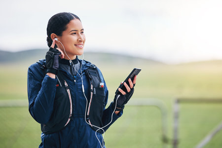 Music, phone and woman smile in the countryside ready for fitness and exercise with mockup. Sports,...