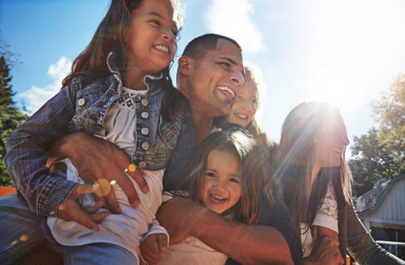 Making every moment together count. Portrait of a happy family spending time together outdoors.の写真素材