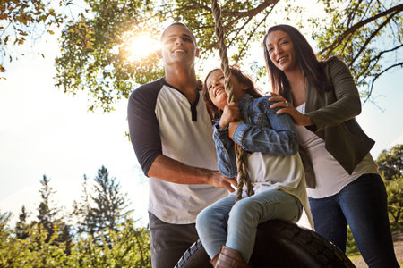 You cant put a price on a strong family bond. Portrait of a happy mother and father pushing their...