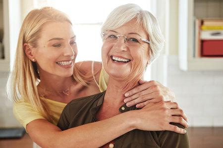 She grew up and became my best friend. a senior woman and her adult daughter at home.