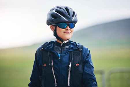 Happy woman, cycling athlete and thinking in nature for exercise, training and triathlon sports....