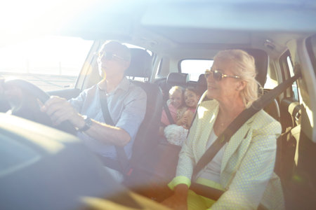 Fun road trip with the grandkids. two little girls going on a road trip with their grandparents.の写真素材