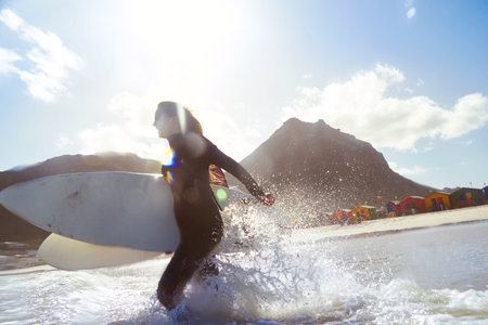 The ocean is their playground. a young couple out surfing together.