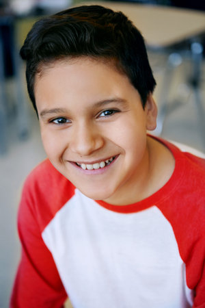 Facing the school day with confidence. Portrait of a smiling elementary student at school.
