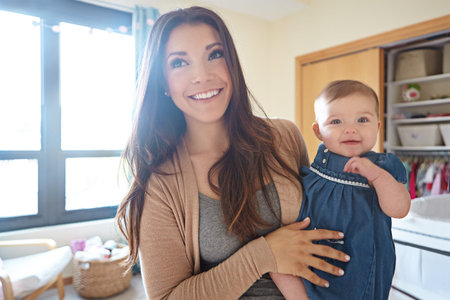 Shes my little baby angel. a mother with her baby girl at home.