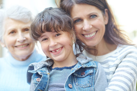 Family is lifes greatest blessing. Portrait of a three generational family sitting outdoors.
