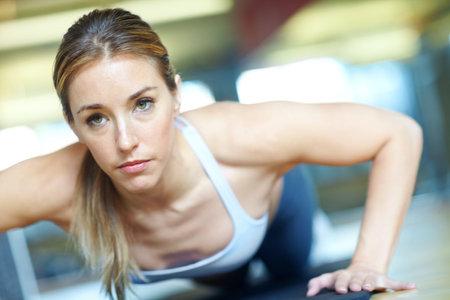 Im making great progress. A beautiful young woman working out at the gym.