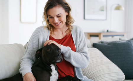Hes always there when I need him. a middle aged woman relaxing at home with her dog.