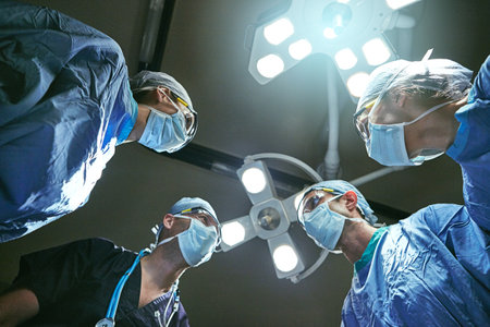Theyre the best in their field. Low angle shot of surgeons in an operating room.の写真素材