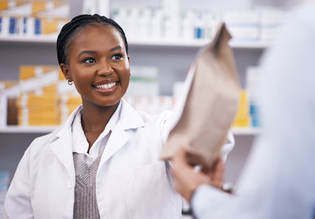 Black woman, medicine or pharmacist hands customer a bag in drugstore with healthcare prescription receipt. Shopping or happy African doctor giving patient pills or package in medical retail serviceの写真素材