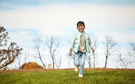 Its play oclock. an adorable little girl spending the day outdoors.の写真素材