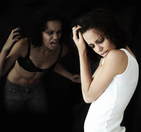 Anorexia, bipolar and woman with stress, identity crisis and depression against a dark studio background. Female person, model and girl with mental health issue, problem and anxiety with traumaの写真素材