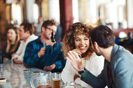 Drinks are always better with the best company. a couple enjoying a drink at a bar.