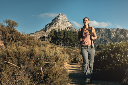 Its going to be such an exciting adventure. a young woman out on a hike through the mountains.の写真素材