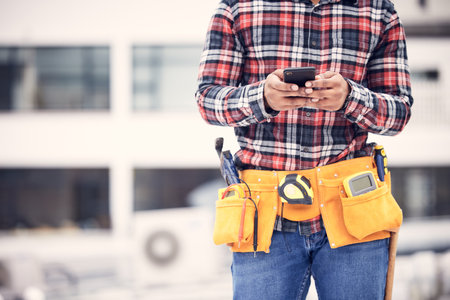 Phone, worker hands or construction man typing internet, online web search and message maintenance industry contact. Connection, smartphone mockup or urban person, contractor or handyman texting userの写真素材