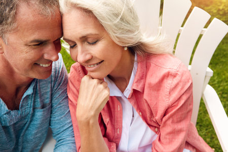 Our love is pure bliss. a senior couple spending their day outside.の写真素材