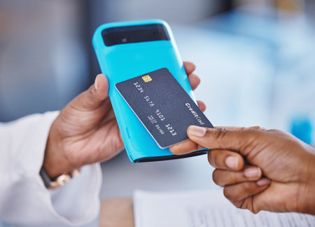 Doctor, hands and credit card in healthcare payment, electronic transaction or purchase at pharmacy. Hand of patient or medical pharmacist paying for service, finance or consultation on mobile deviceの写真素材