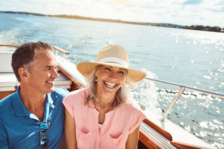 Good vibes out on the ocean. a mature couple enjoying a relaxing boat ride.の写真素材