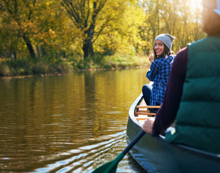 Kayaking season is here again. a young couple going for a canoe ride on the lake.の写真素材