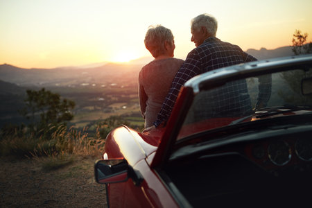 The world was meant to be enjoyed. a senior couple enjoying a road trip.の写真素材