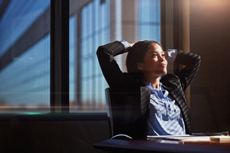 I never leave anything undone. a businesswoman sitting thoughtfully in her office.の写真素材