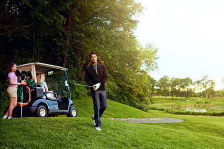 Theyre all golfing fanatics. a man playing a round of golf with his friends.の写真素材