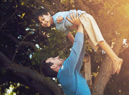 It takes a special person to be a dad. Portrait of a father and his young son spending quality time together outside.の写真素材