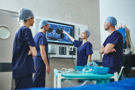 Theyre the experts in saving lives. a team of surgeons discussing a patients medical scans.