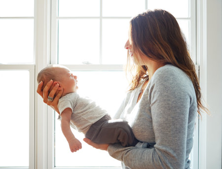 Mommys bundle of joy. a mother holding her newborn baby.の写真素材
