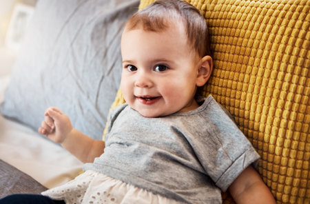 If anyone needs me, Ill be here, chilling. Portrait of an adorable baby girl relaxing on the bed at home.の写真素材
