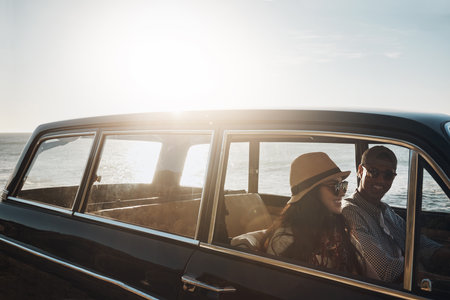 Their first date was a road trip. a young couple enjoying a road trip along the coast.の写真素材