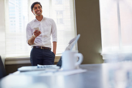 Lets discuss this over video conference, shall we. a businessman working on his smartphone in the...