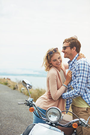 Youre still the most beautiful view to me. a couple having a intimate moment while out on the road.