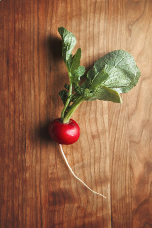 Radish has never looked so ravishing. High angle shot of fresh radish on a wooden surface.の写真素材