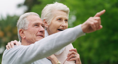 New experiences nourish the soul. a happy senior couple spending a romantic day in the park.の写真素材