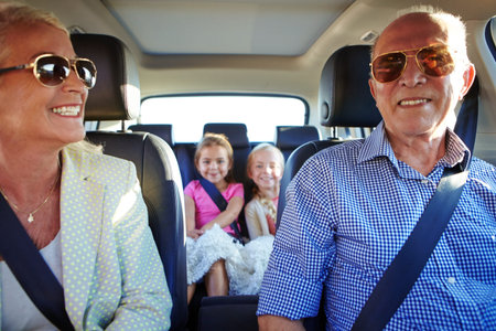 Get out there and have fun. two little girls going on a road trip with their grandparents.