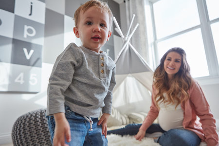 Before you know it, theyll be not so little anymore. a pregnant woman bonding with her toddler son...