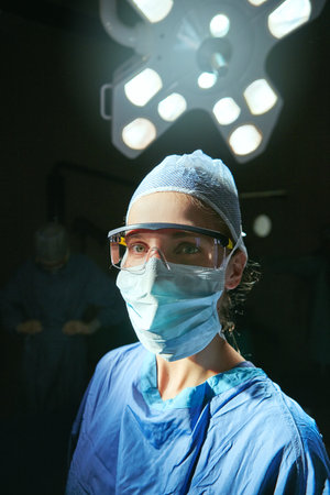 My patients always come first. Cropped portrait of a female doctor against a dark background.の写真素材