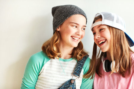 We love a little talk before we start dancing. young girls in a dancing studio.の写真素材