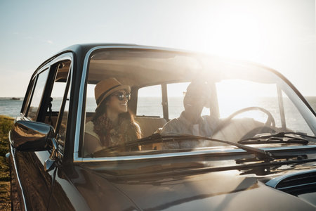 Summer days are for long leisurely drives. a young couple enjoying a road trip along the coast.