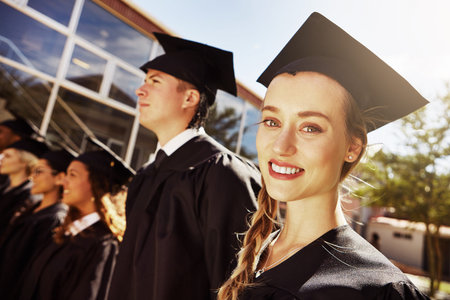 She has a bright future ahead of her. Portrait of a smiling university student on graduation day...