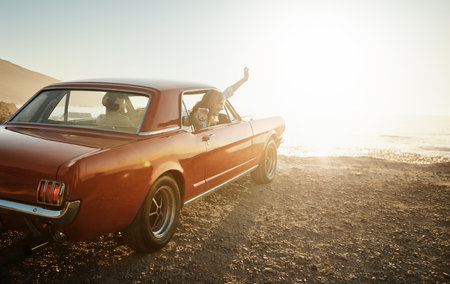 Feeding their adventurous souls. a young couple enjoying a road trip together.の写真素材