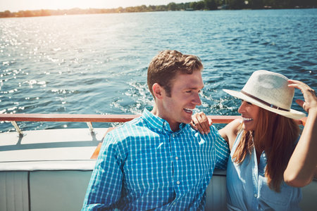 All aboard the love boat. a young couple spending time together on a yacht.の写真素材