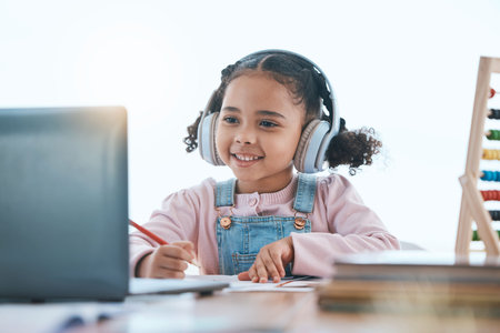 Online education, laptop and headphones of child in e learning, language translation and writing in...