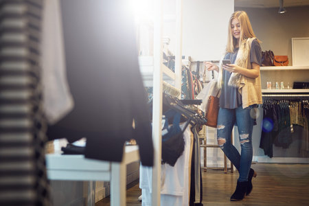 Im definitely adding this to my list of favorite stores. a young woman using her cellphone while out...