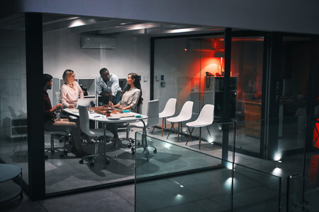 Tonight, its all about results. colleagues having a meeting during a late night in a modern office.