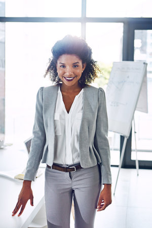 Shes got a business presence that exudes confidence. Portrait of a corporate businesswoman in an office.の写真素材