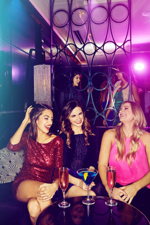 Forget sleep, tonight is all about fun. a group of young women enjoying a night out at the club.