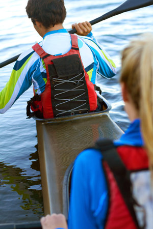 Back, man and woman on water in kayak for rowing, sport and fitness for health, wellness and...